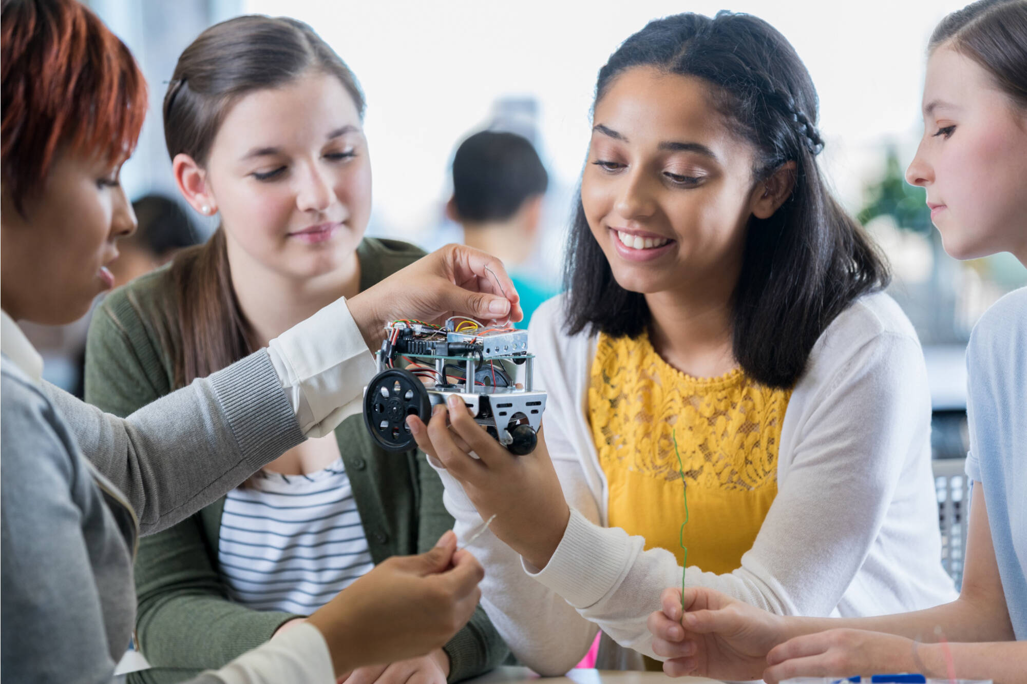Middle school students work on an engineering project